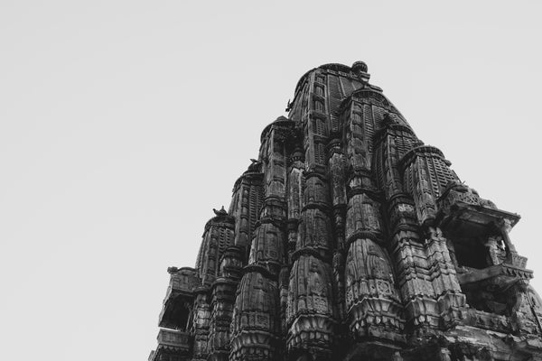 a black and white photo of a very tall building