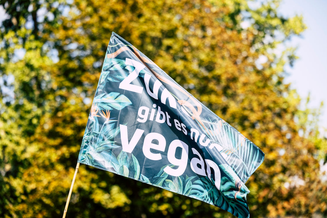 a green flag with the words vegan on it