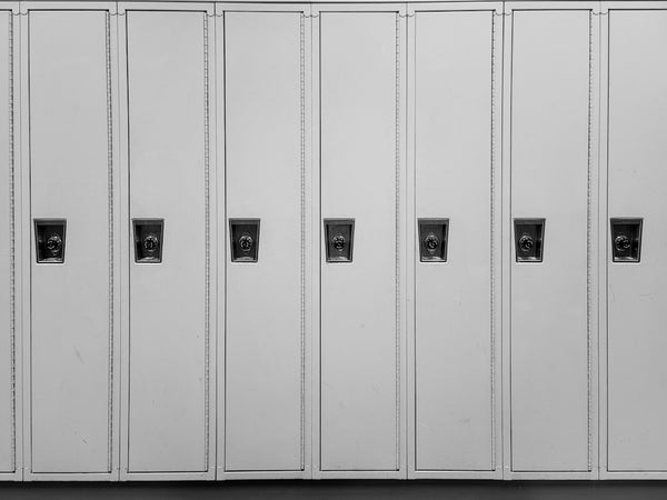 a row of white lockers sitting next to each other