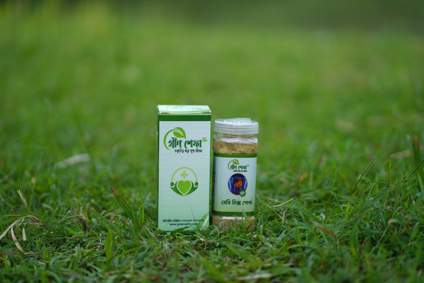 Herbal medicine bottle and box on grass