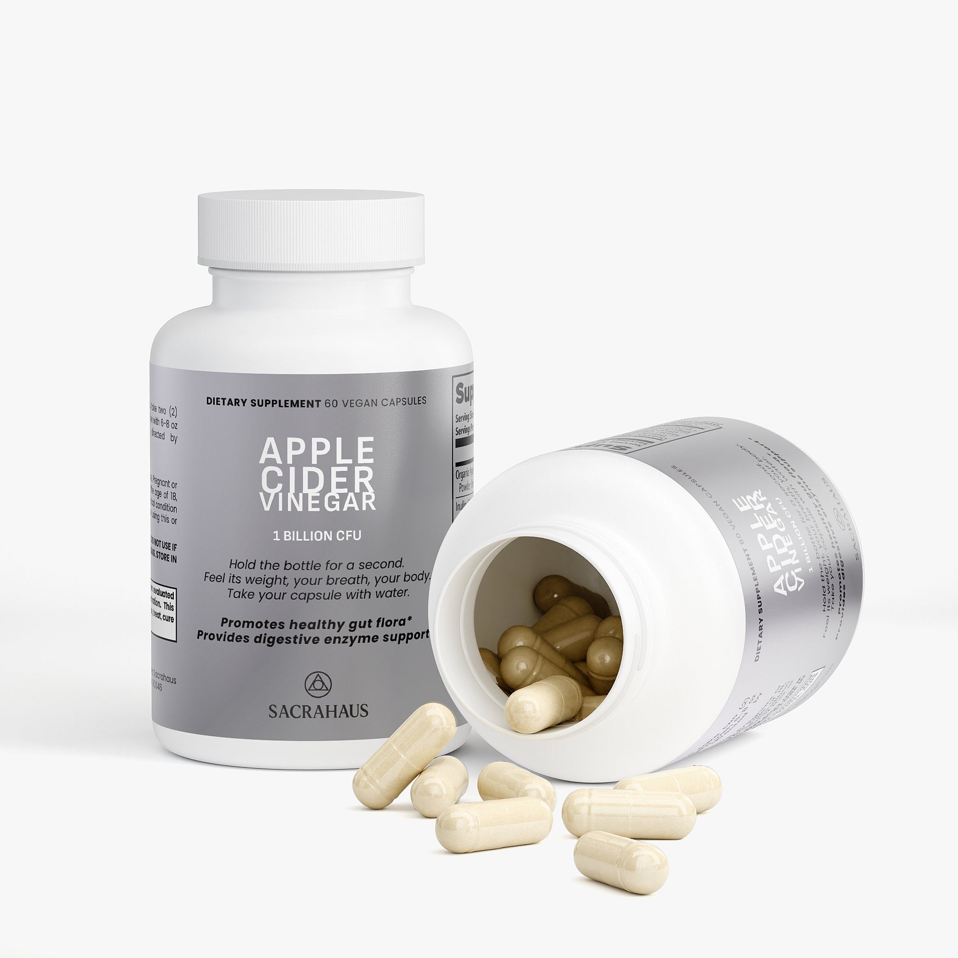 SACRAHAUS apple cider vinegar capsules in a bottle with spilled capsules on a white background
