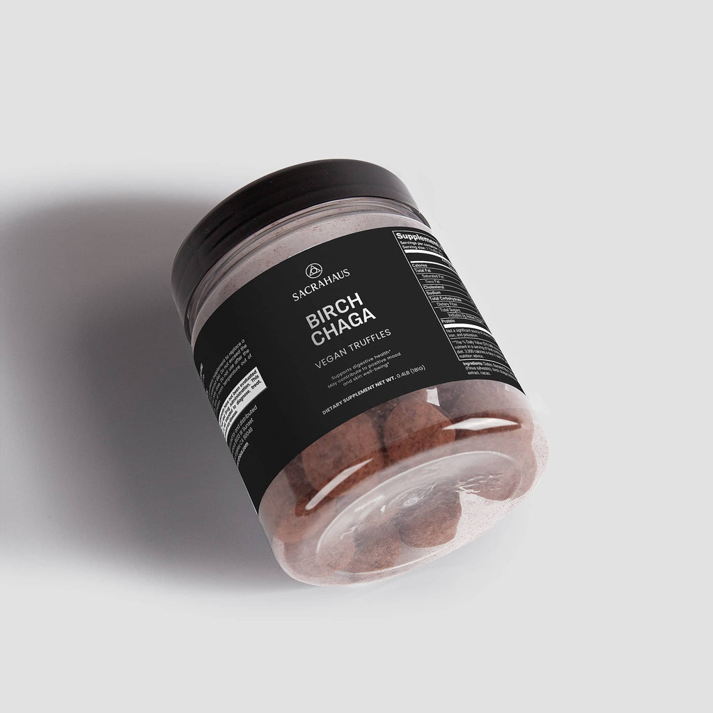 SACRAHAUS Birch Chaga Truffles in a clear jar, promoting digestive support and vegan health benefits