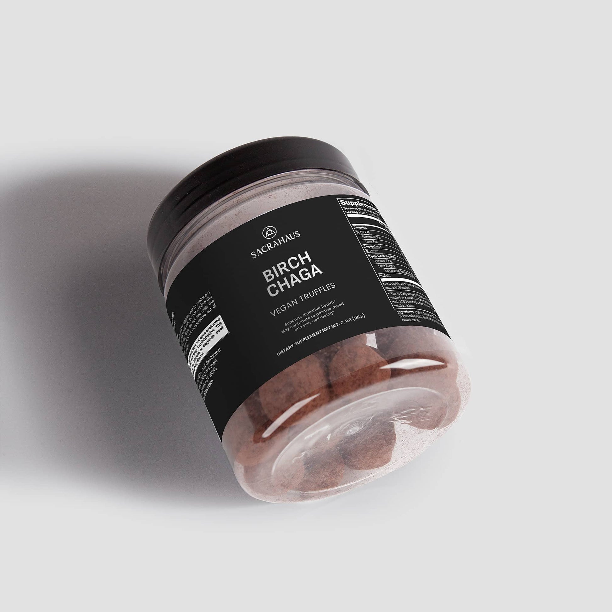SACRAHAUS Birch Chaga Truffles in a clear jar, promoting digestive support and vegan health benefits