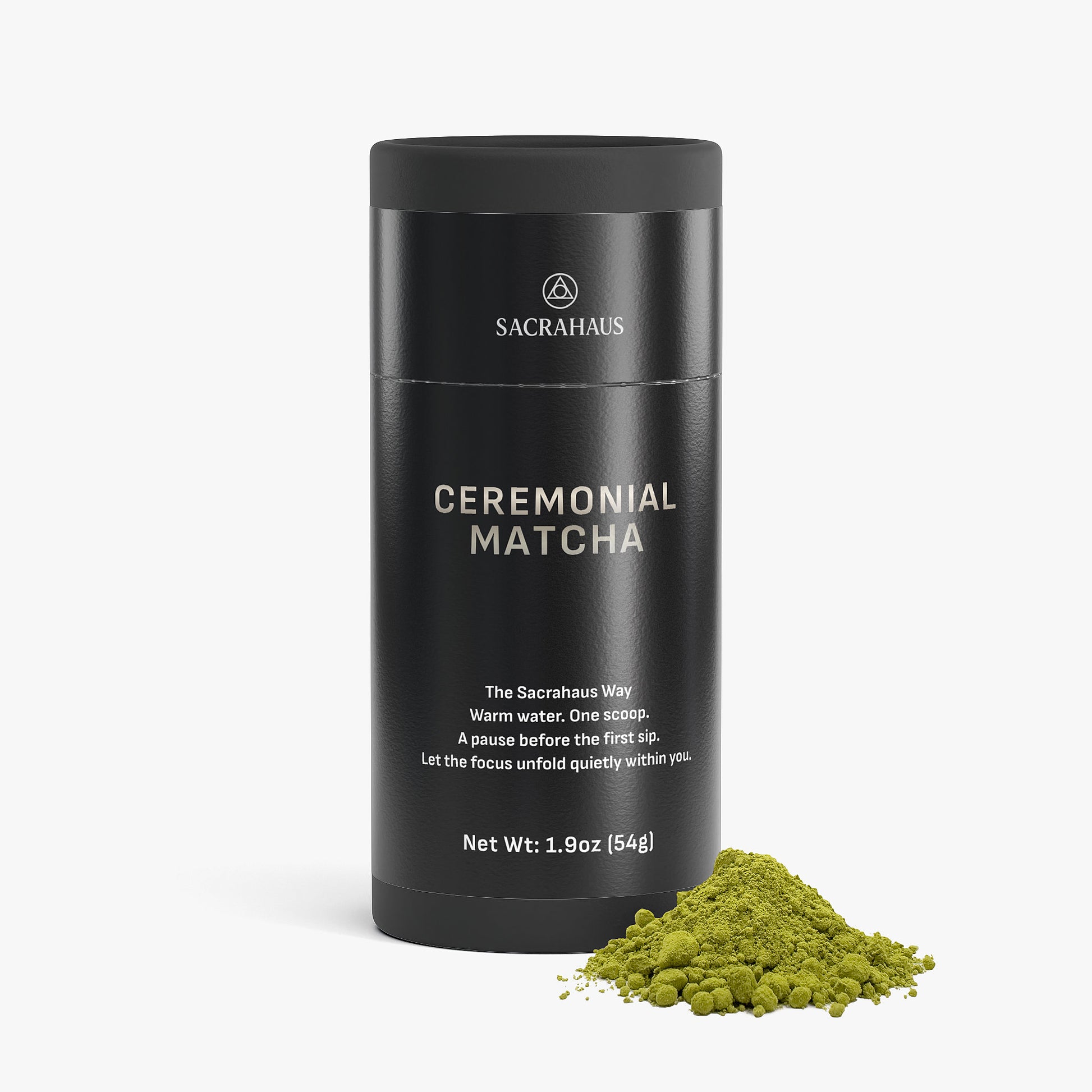 SACRAHAUS ceremonial matcha powder in a sleek container with a scoop and spilled powder on a white background