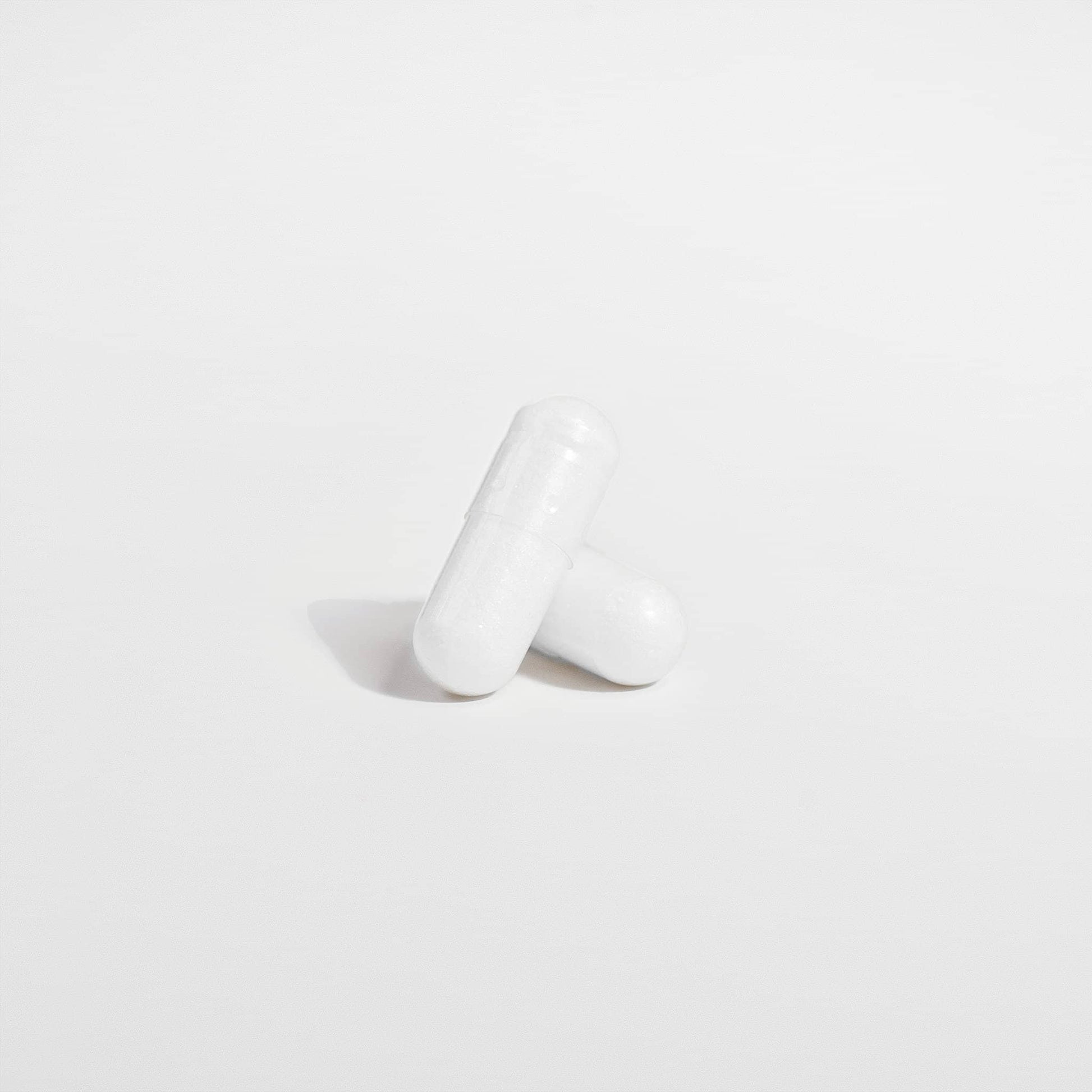 SACRAHAUS magnesium glycinate vegan supplement capsules on a white background