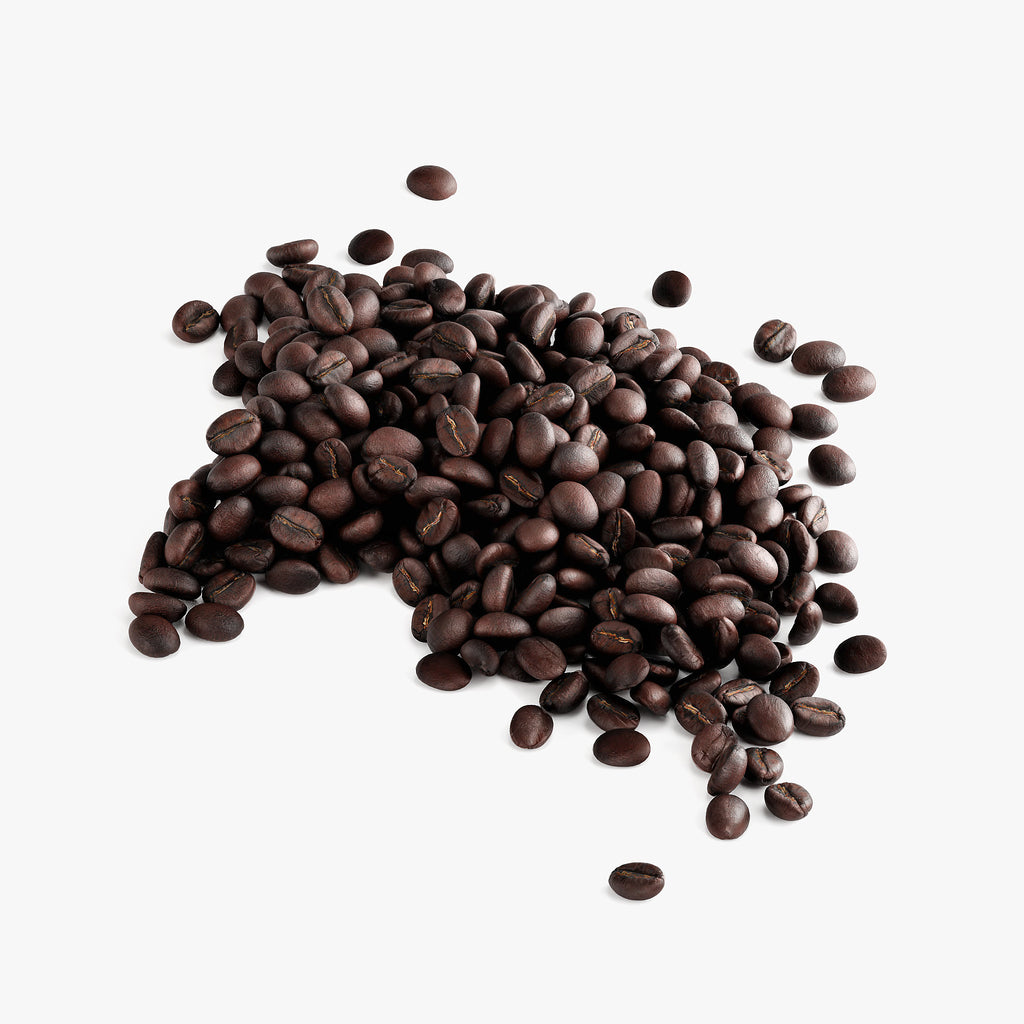 SACRAHAUS molten caramel dark roast coffee beans scattered on a white background