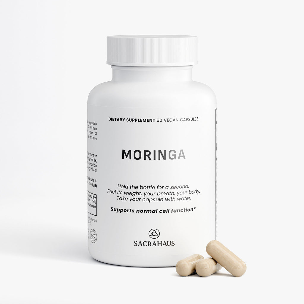 SACRAHAUS organic moringa capsules in a white bottle with 60 vegan capsules for cell function support