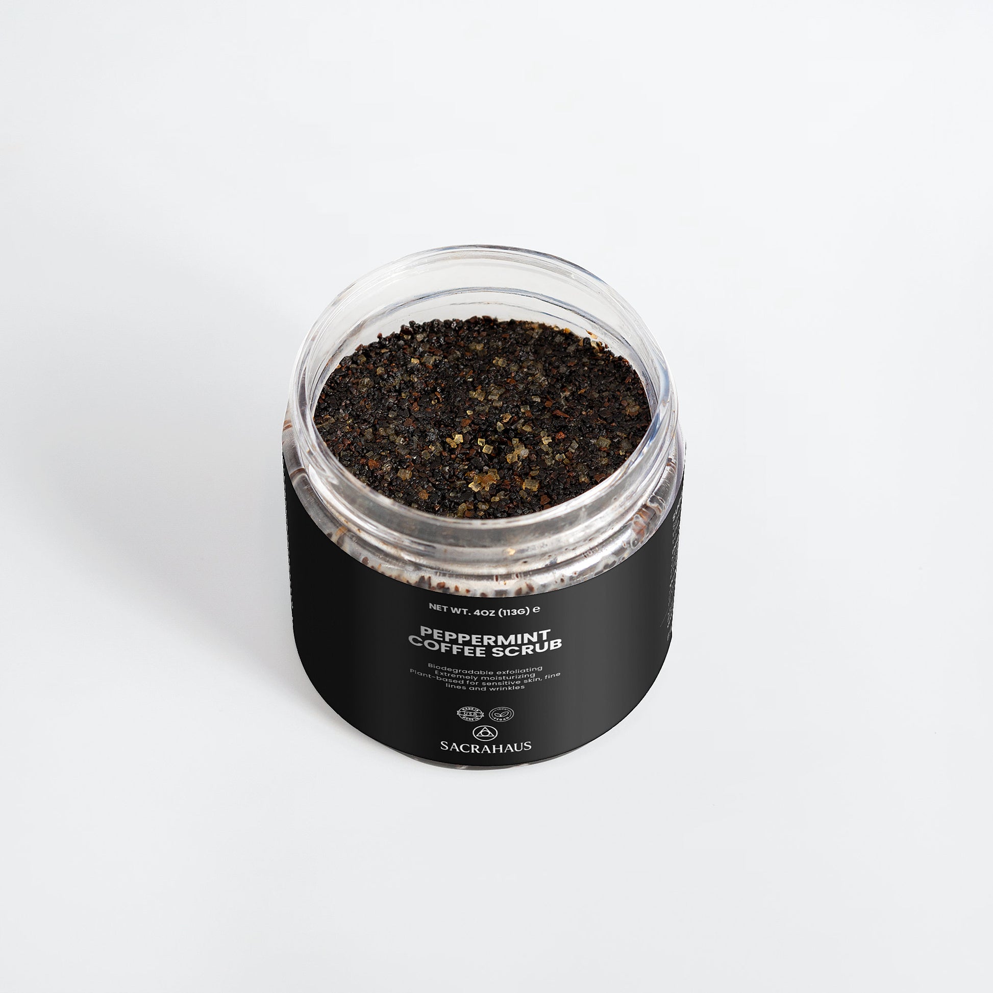SACRAHAUS peppermint coffee scrub for sensitive skin in a clear jar with black label