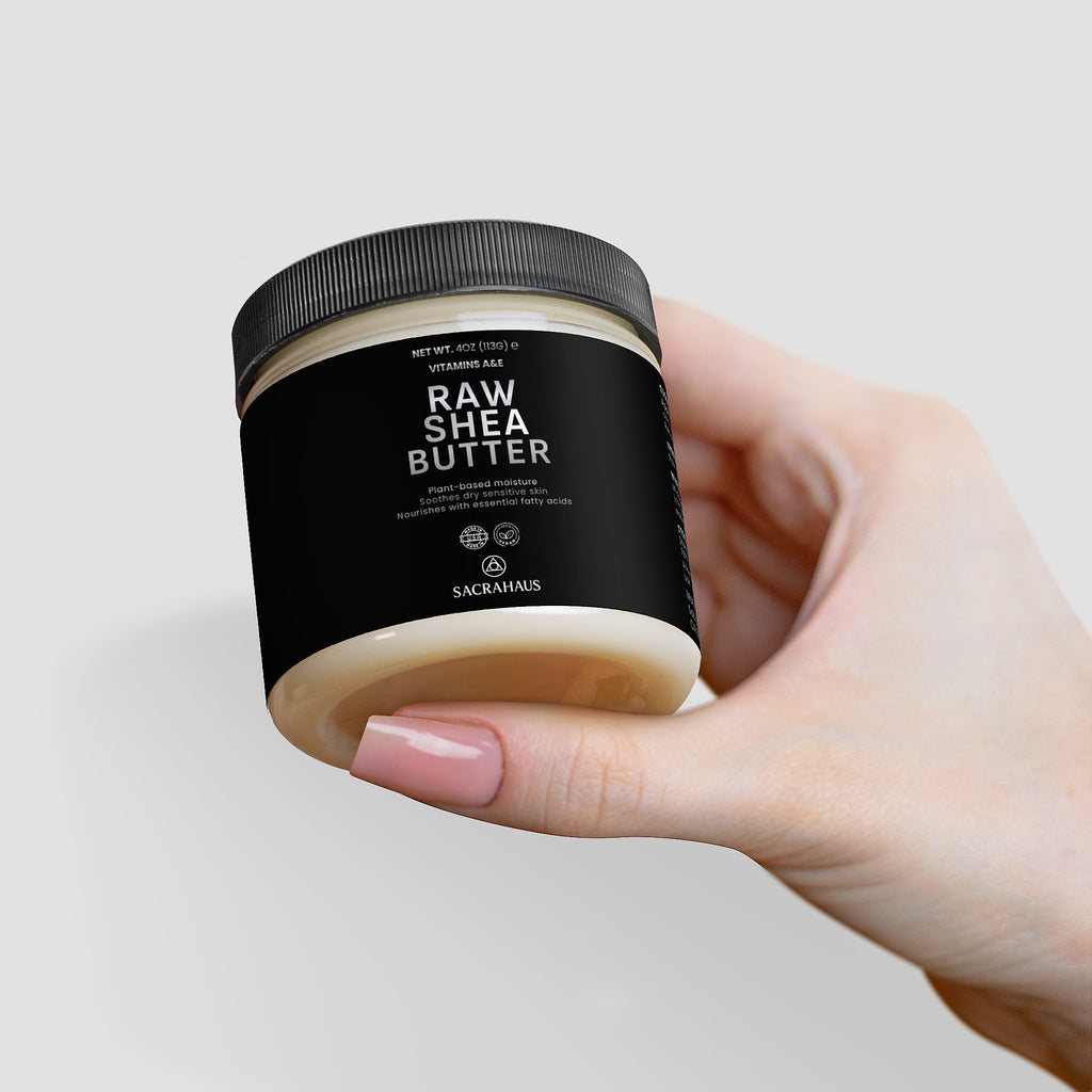 SACRAHAUS Raw Shea Butter for Skin in a jar held in a hand, perfect for moisturizing and nourishing