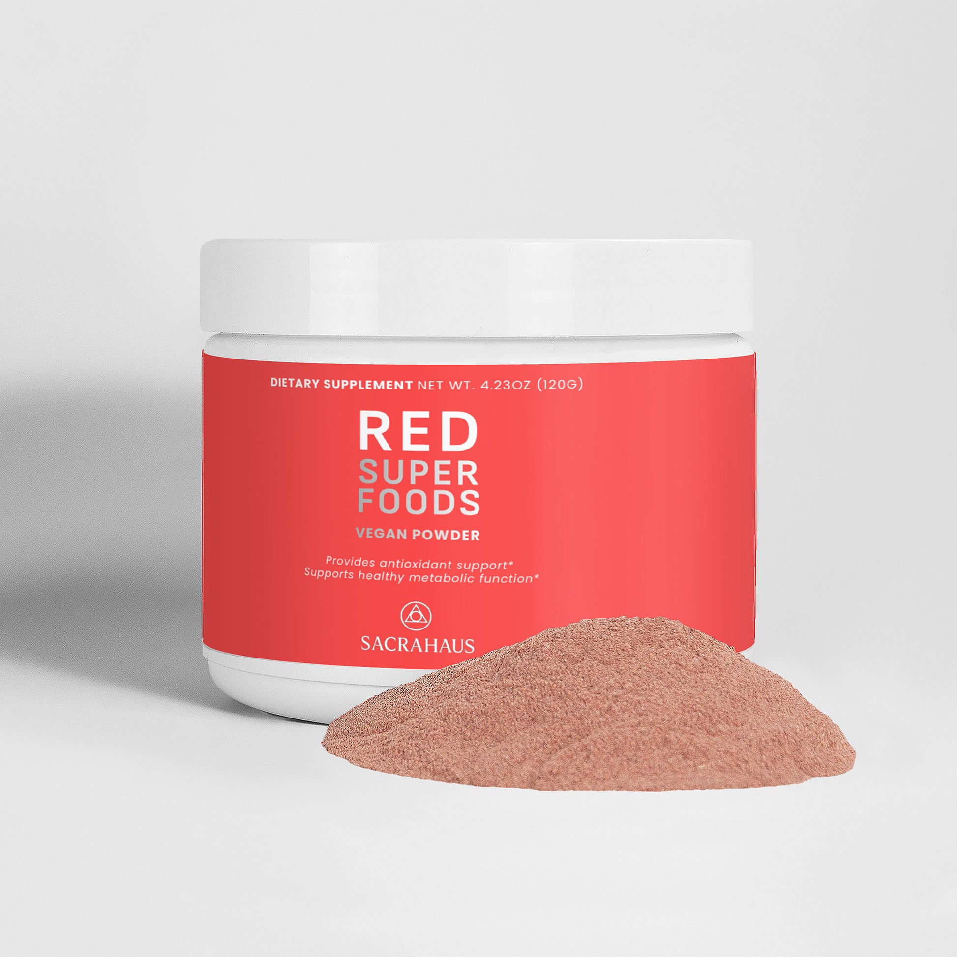 SACRAHAUS red superfood powder vegan in a white container with a scoop of powder beside it