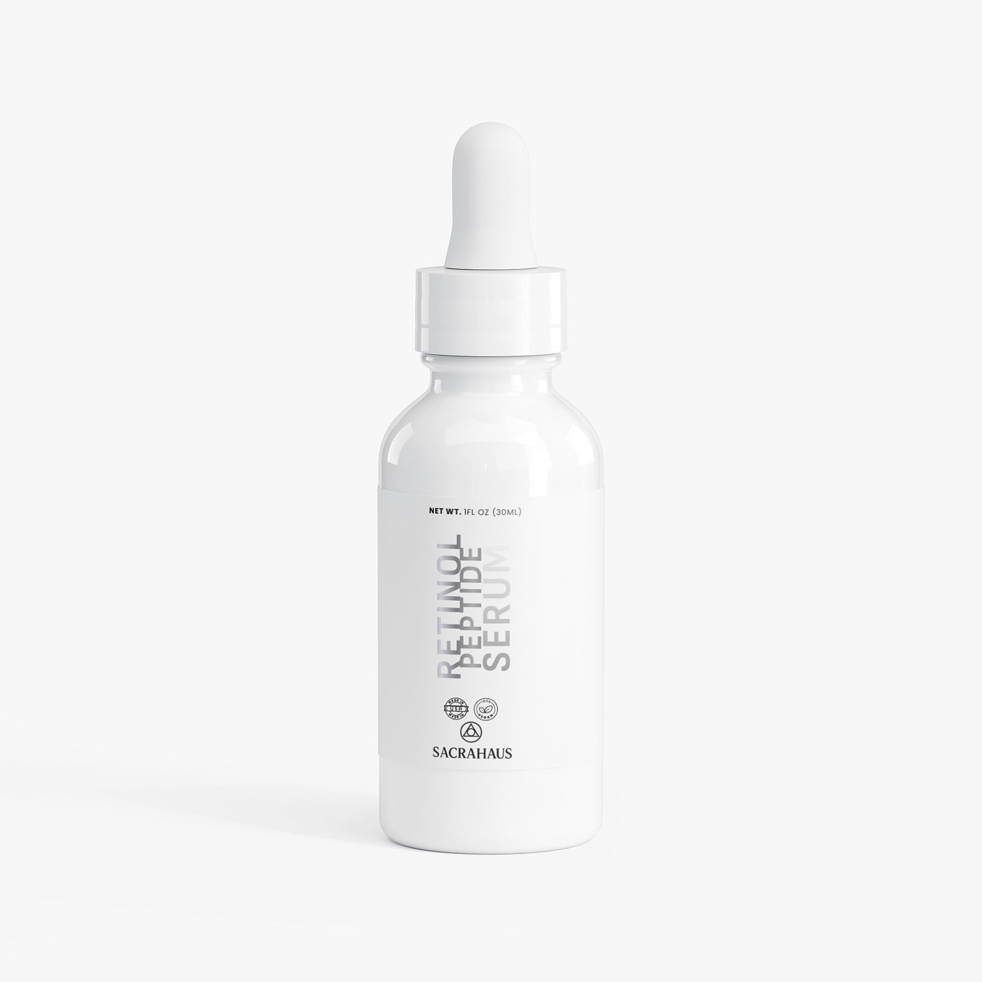 SACRAHAUS Retinol Peptide Face Serum in a sleek white bottle designed for radiance and skin revitalization