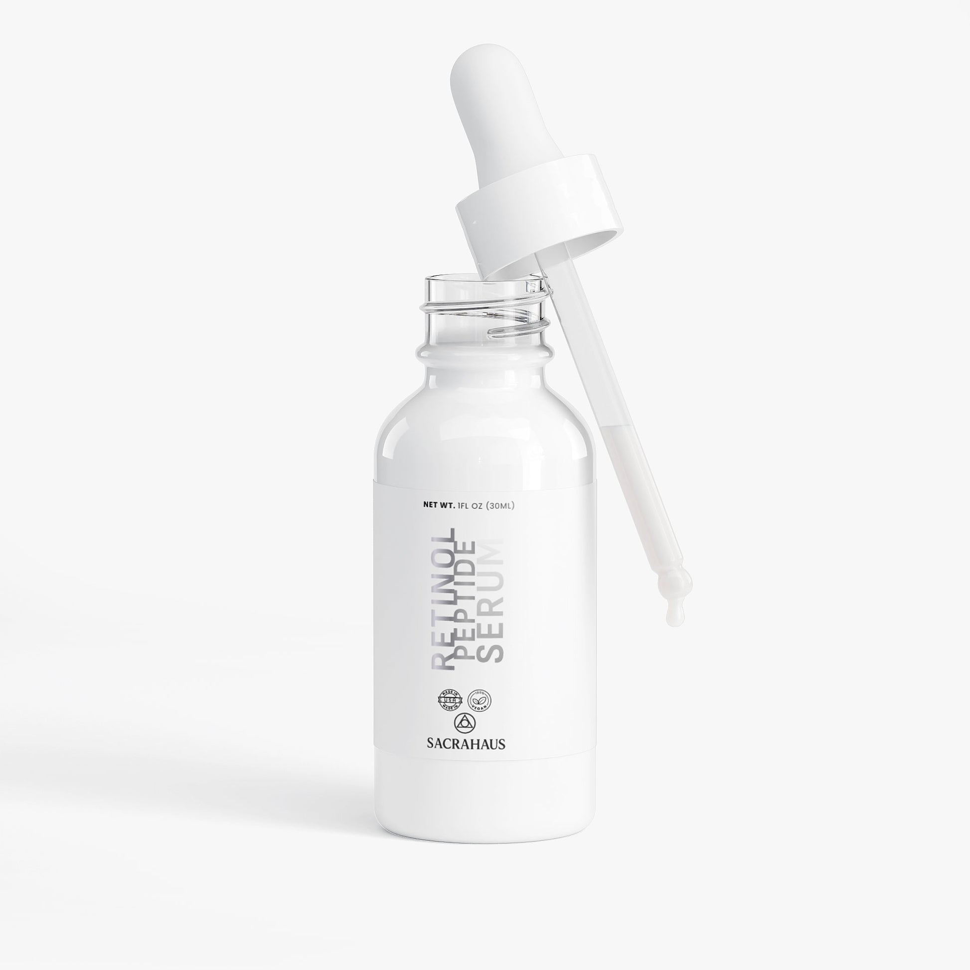 SACRAHAUS retinol peptide face serum in a sleek bottle with dropper for radiant skin