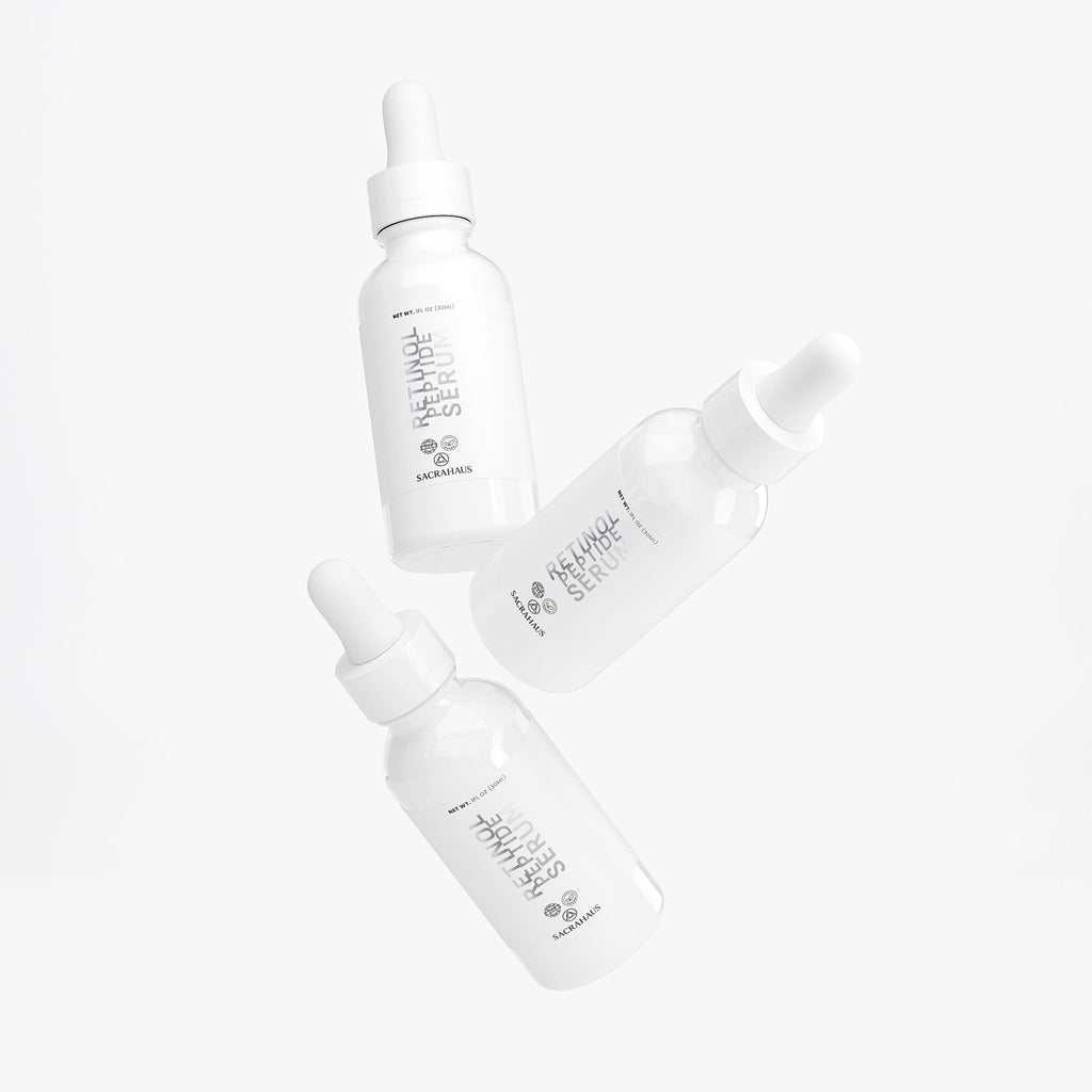 SACRAHAUS retinol peptide face serum in sleek white dropper bottles for glowing skin