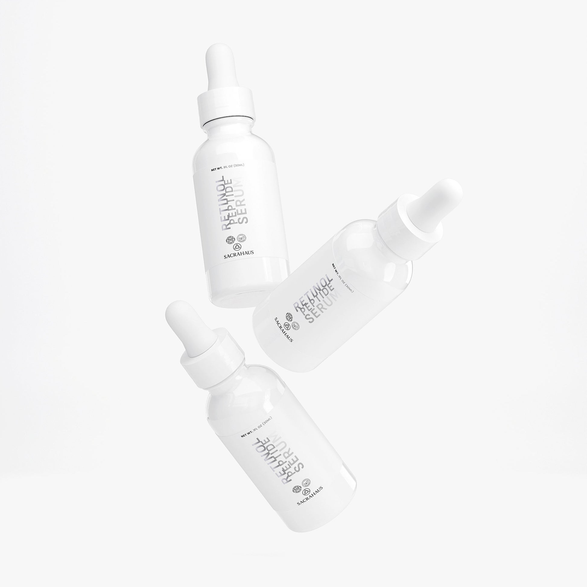SACRAHAUS retinol peptide face serum in sleek white dropper bottles for glowing skin