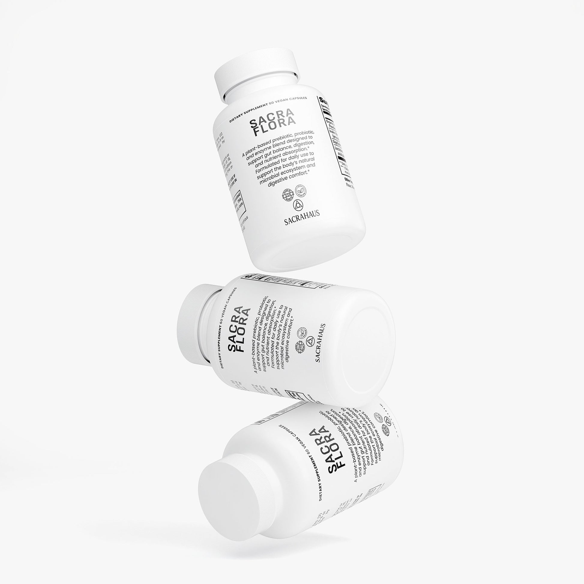 SACRAHAUS vegan gut health supplements stacked in three white bottles for digestive support