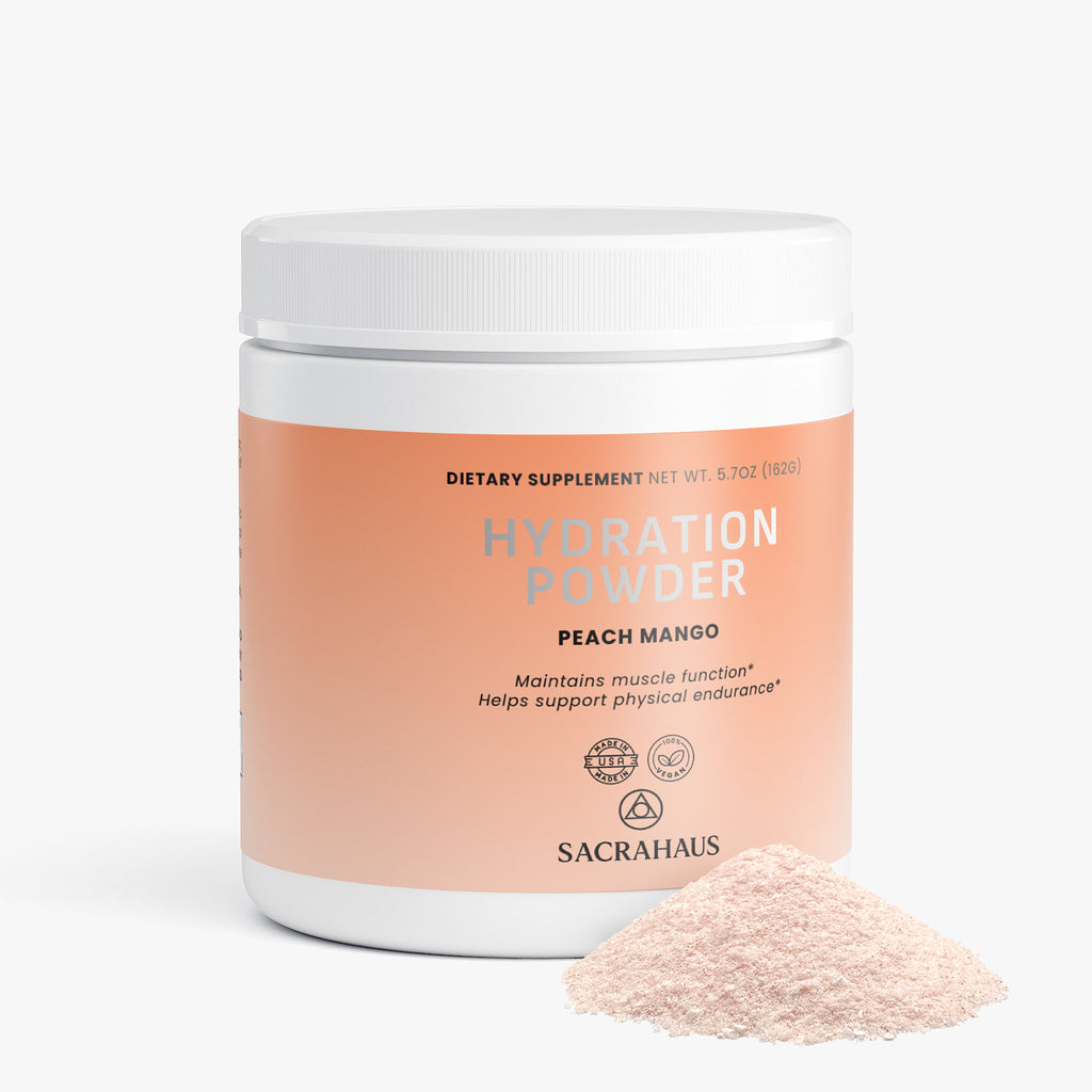 SACRAHAUS vegan hydration powder peach mango in a container with powder spilled beside it