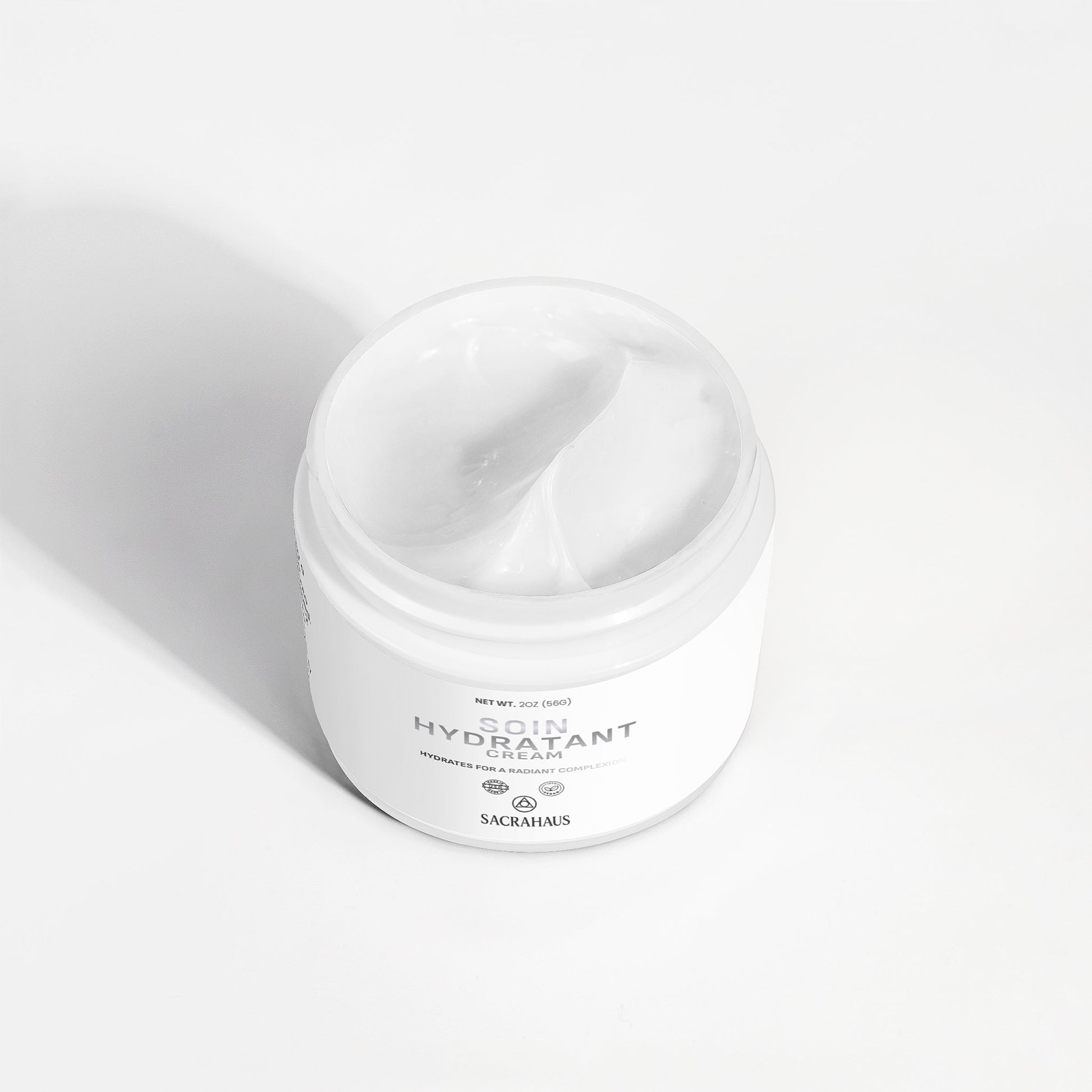 SACRAHAUS vegan skin hydration cream in a white jar, ideal for deep moisturizing and skin nourishment