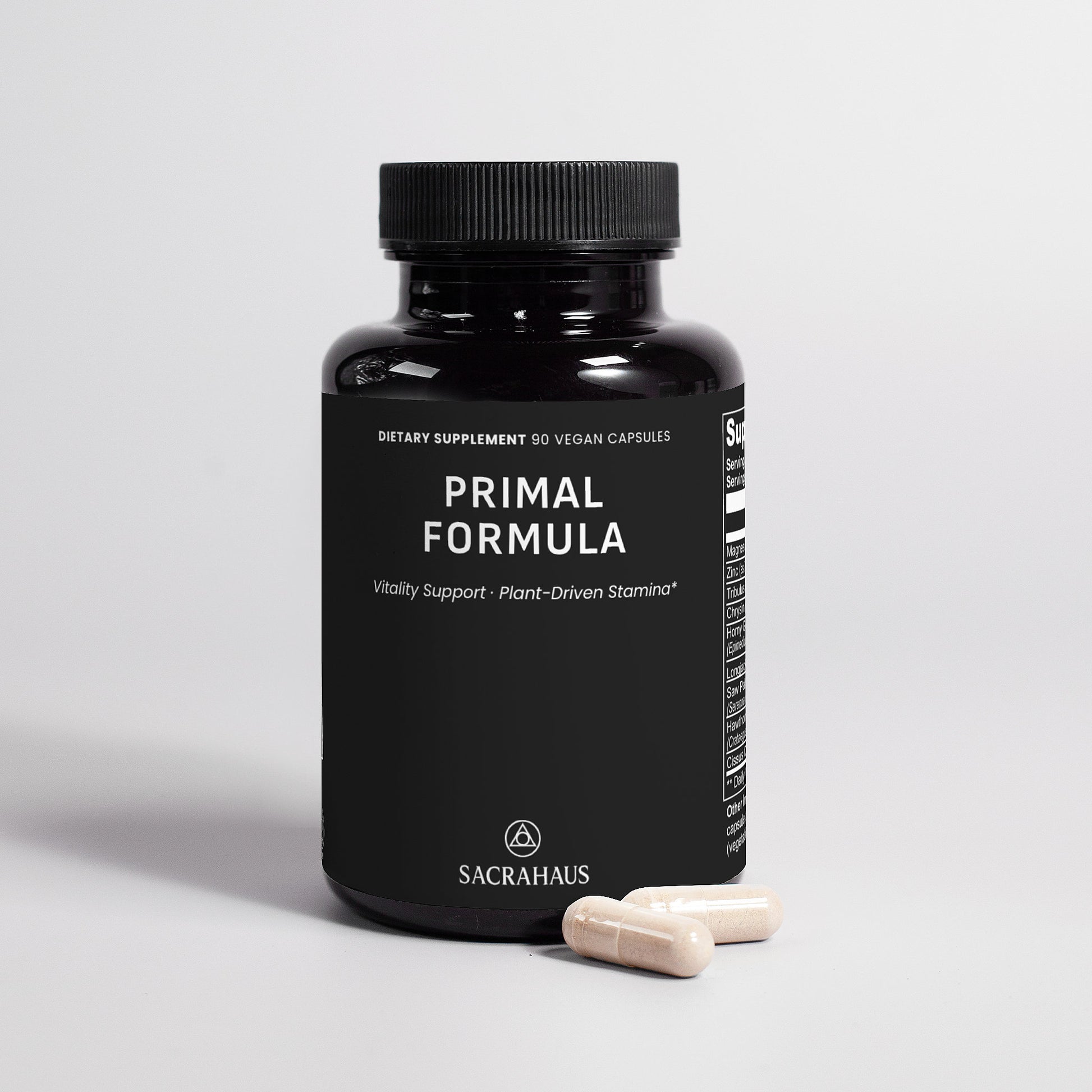 SACRAHAUS Primal Formula vegan supplements for men bottle with two capsules on white background