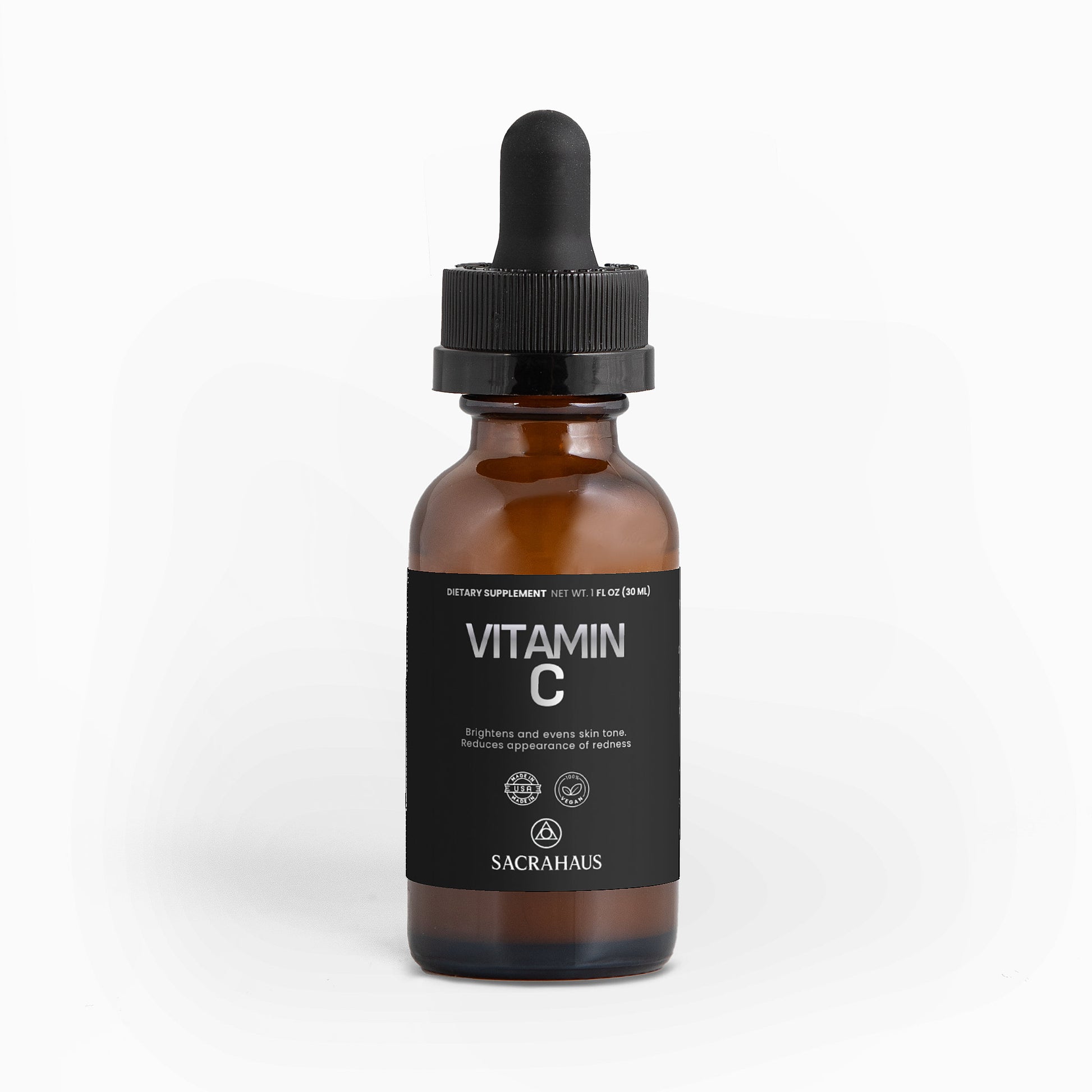 SACRAHAUS vegan vitamin C serum in a brown glass bottle with a dropper for brightening skin